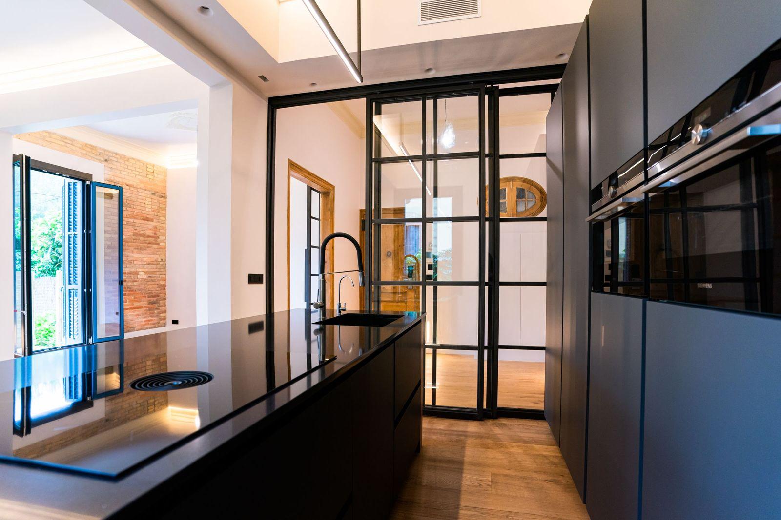 Kitchen with Siemens ovens and Crittall glass partition
