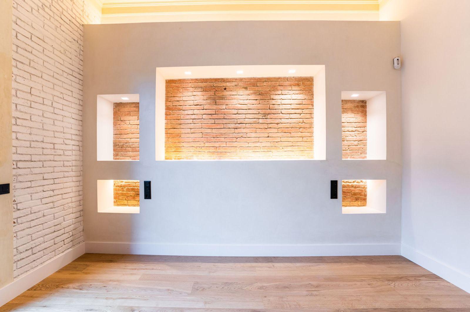 Suite with illuminated brick niche wall