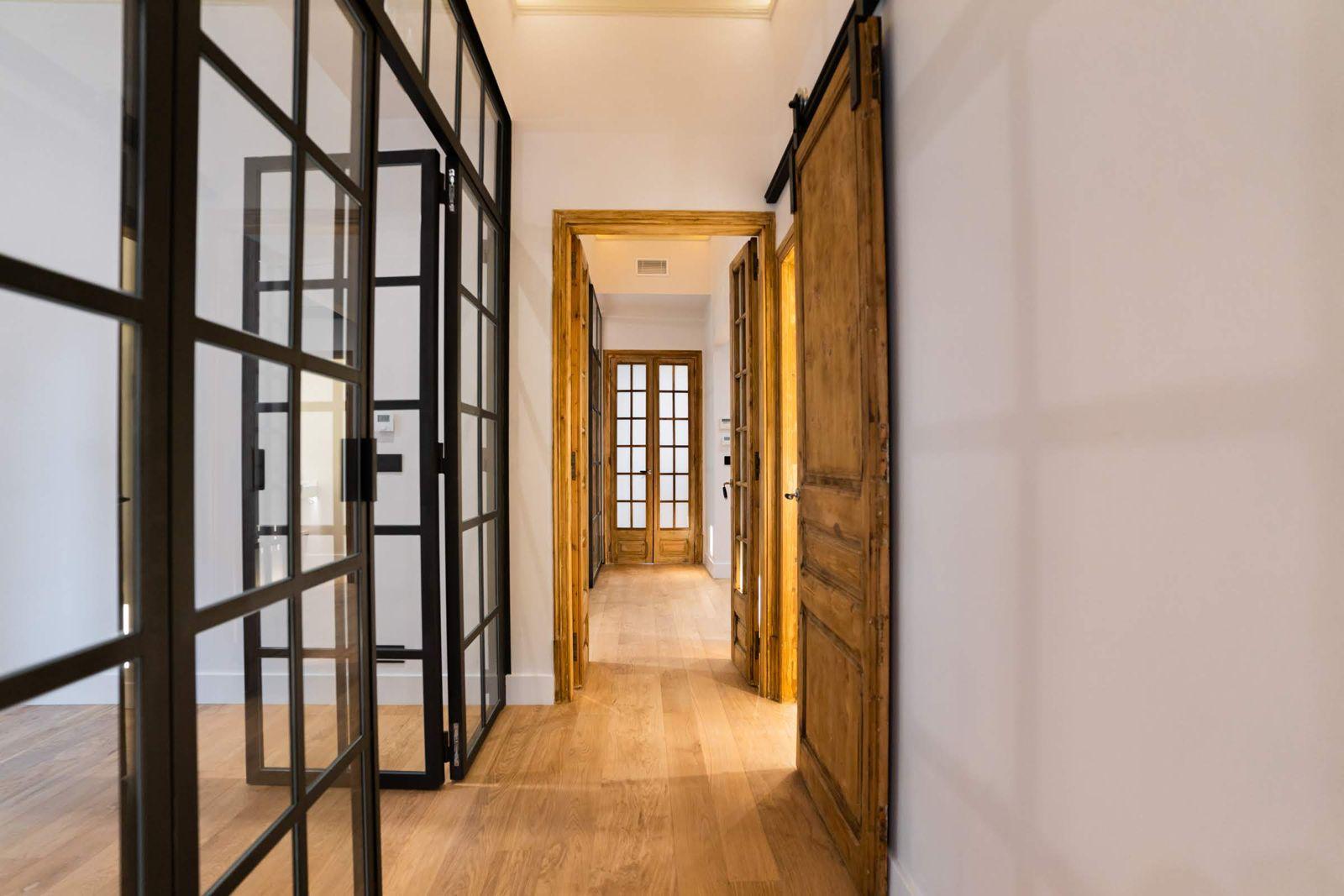 Corridor with original sliding barn door