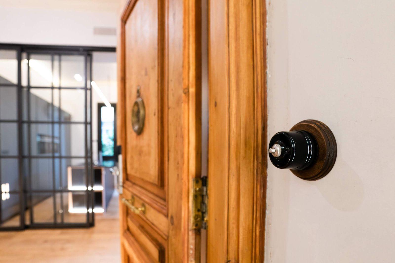 Restored original wooden door with brass fittings