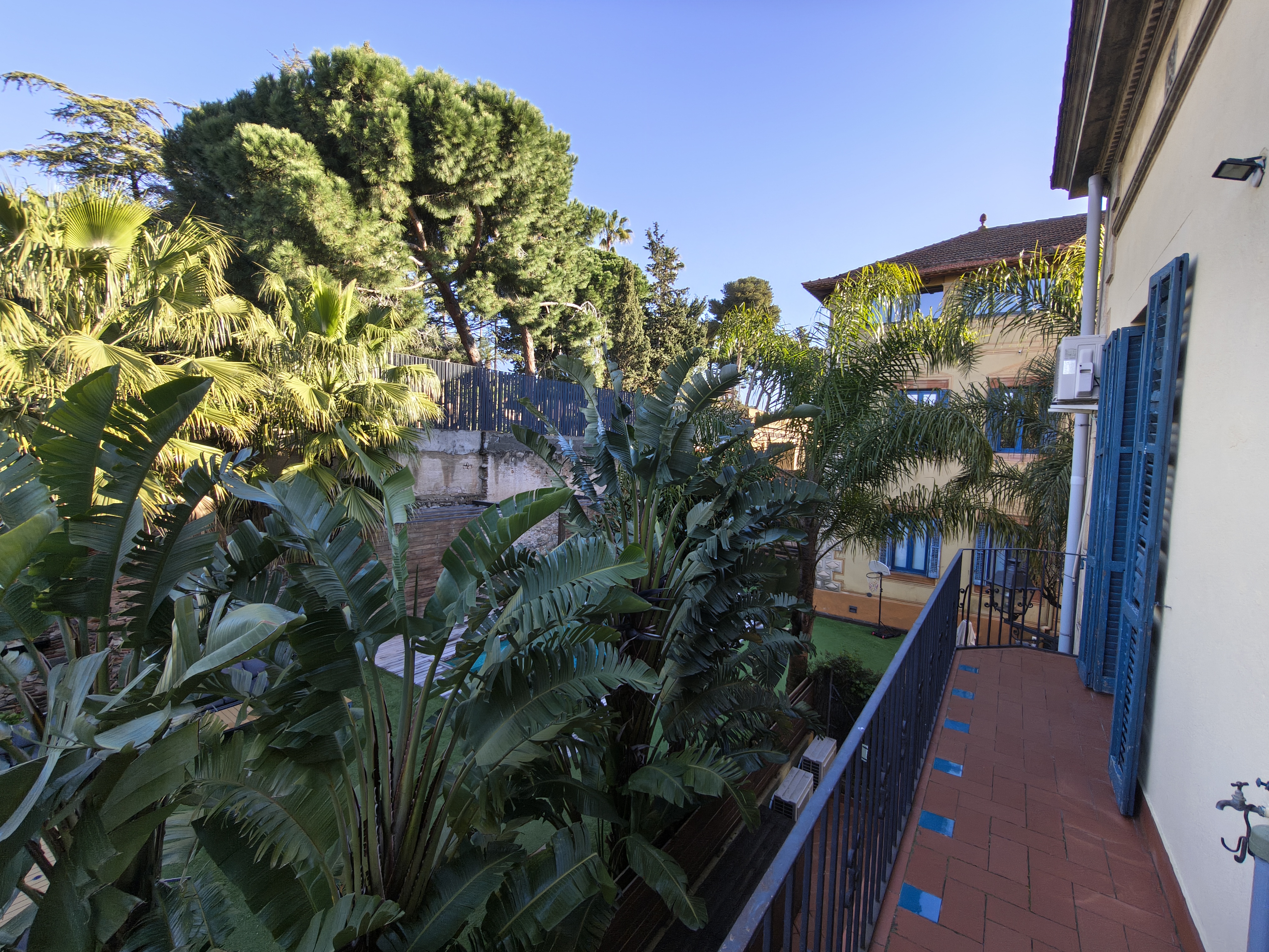 Balcony view over the gardens and pool