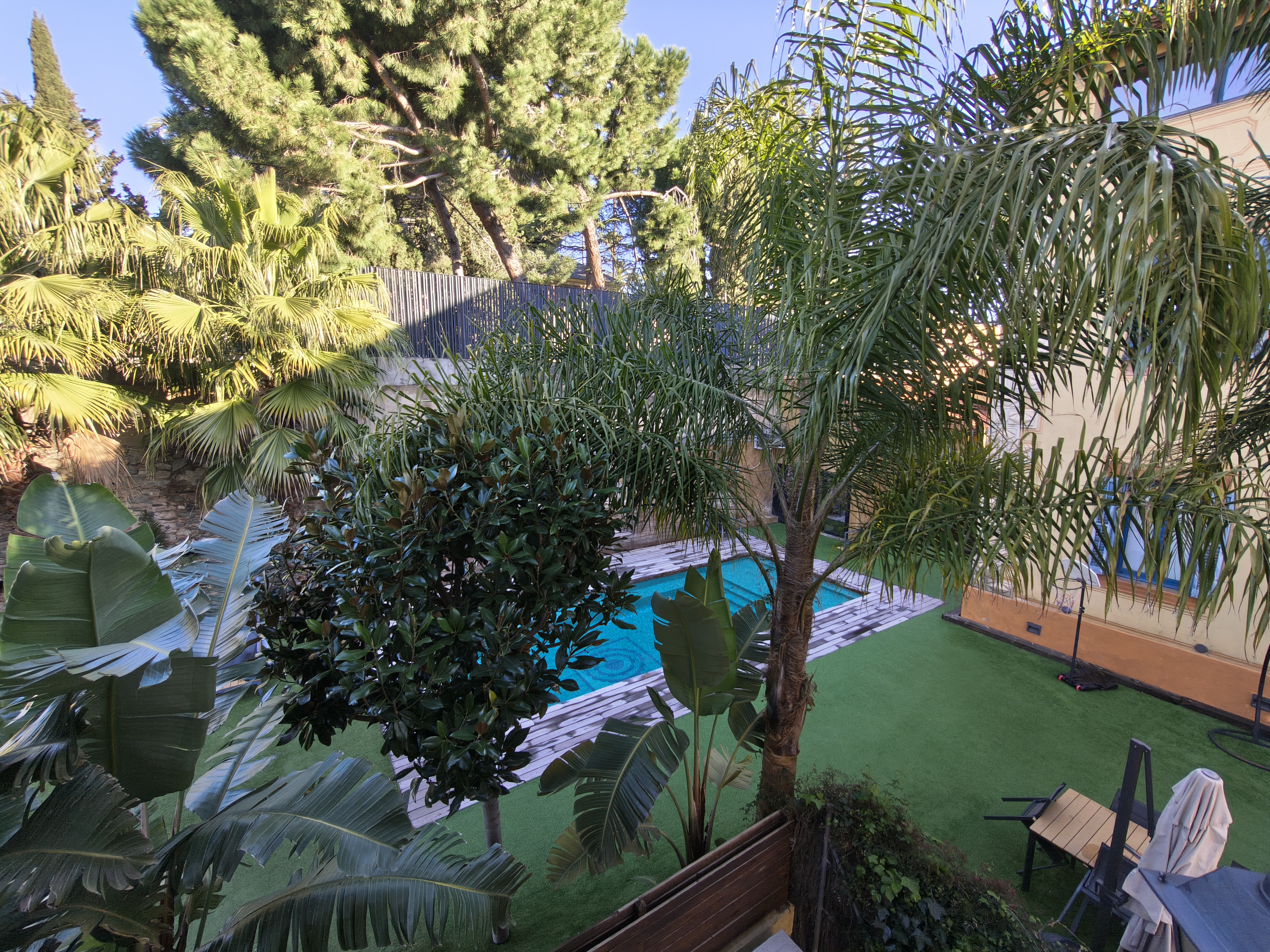 Balcony view over the gardens and pool